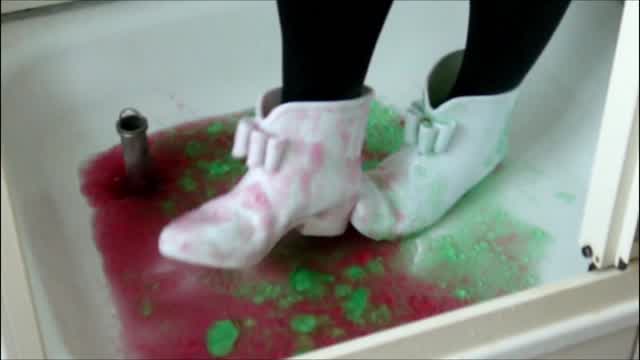 Jana wet fill messy and squeaky with her white rubber ankle boots in shower trailer