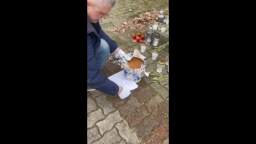 Pro-Ukrainian activist Valdas Bartkevicius brought a bucket of feces he collected to the memorial to